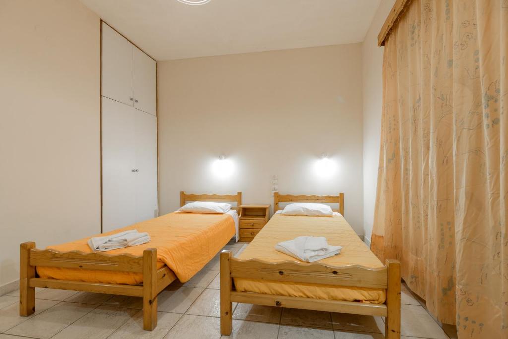 Postel nebo postele na pokoji v ubytování Pink Panther Studios & Apartments