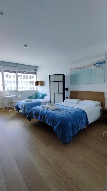 Posteľ alebo postele v izbe v ubytovaní Apartamentos Pillotegi parking gratuito