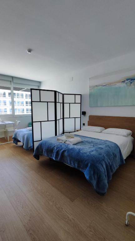 Posteľ alebo postele v izbe v ubytovaní Apartamentos Pillotegi parking gratuito