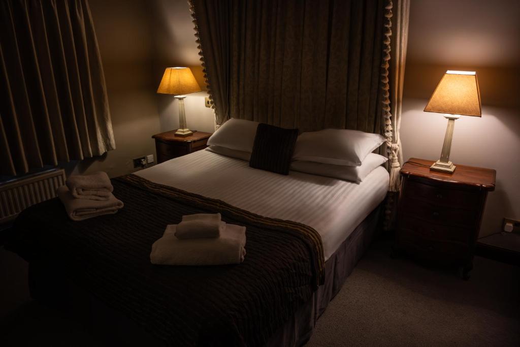 Postel nebo postele na pokoji v ubytování Pennine Manor Hotel