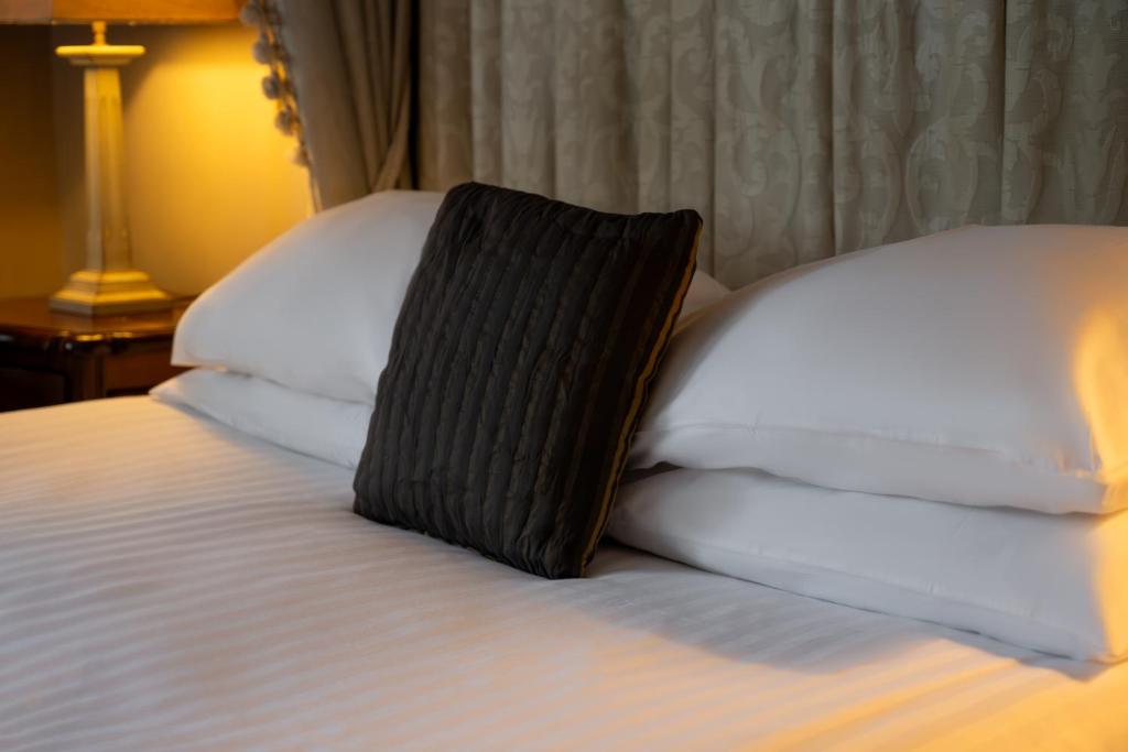 Postel nebo postele na pokoji v ubytování Pennine Manor Hotel