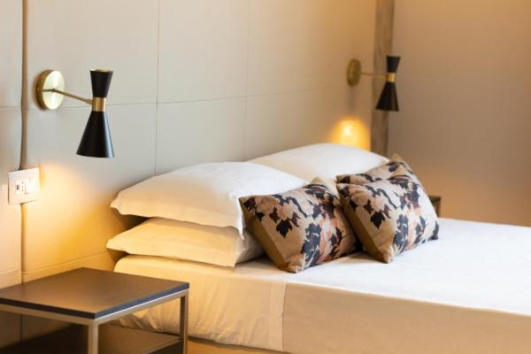 Postel nebo postele na pokoji v ubytování Hotel Mondial