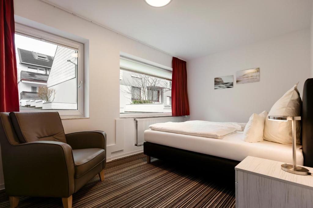Postel nebo postele na pokoji v ubytování Hotel Felsen-Eck