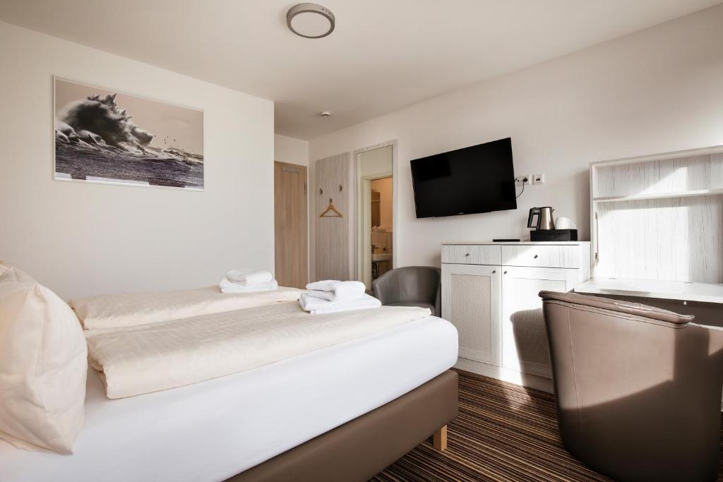 Postel nebo postele na pokoji v ubytování Hotel Felsen-Eck