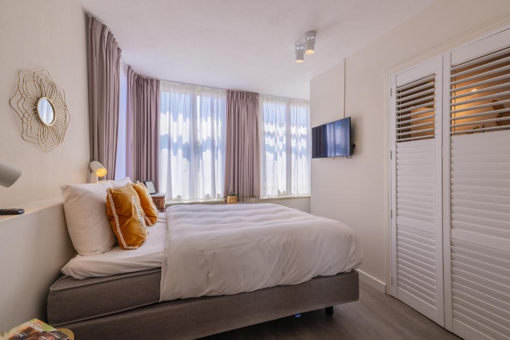 Postel nebo postele na pokoji v ubytování LOT Hotel