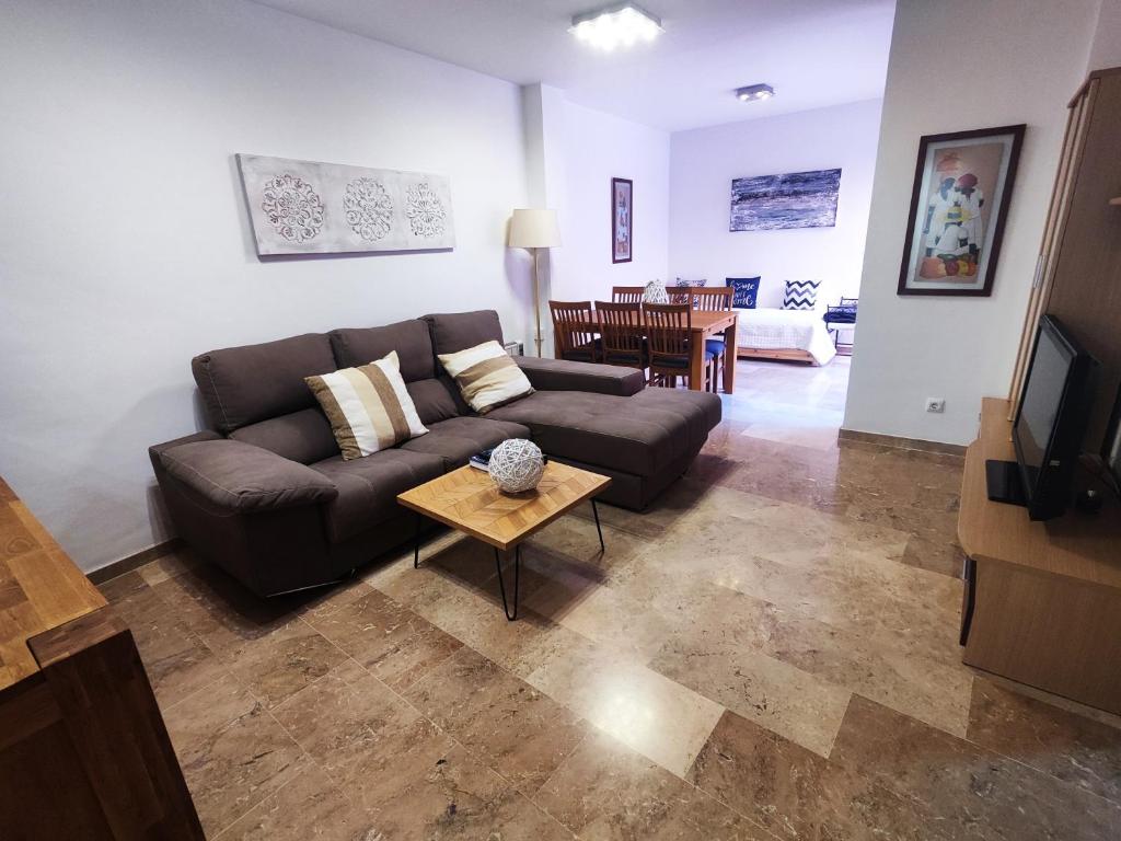 a living room with a couch and a table at Apartamento a 150m de la playa in Palamós