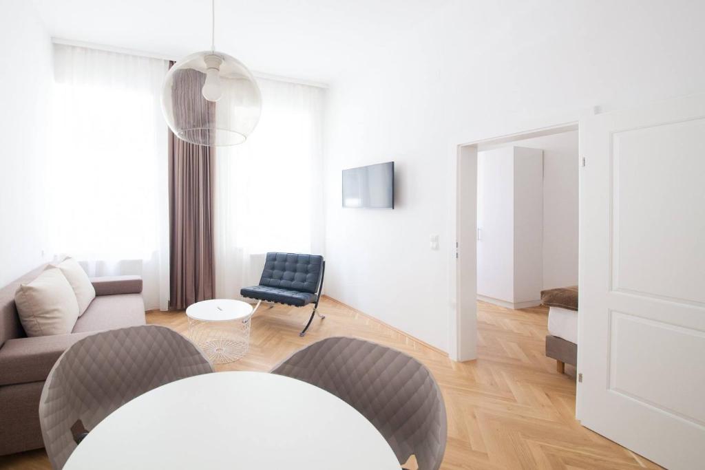 Uma televisão e/ou sistema de entretenimento em KS70 Apartments