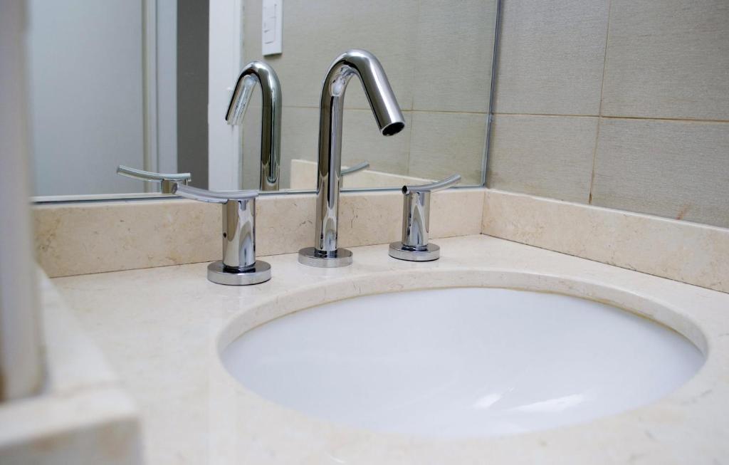 Koupelna v ubytování Le Batiment Apartmentos