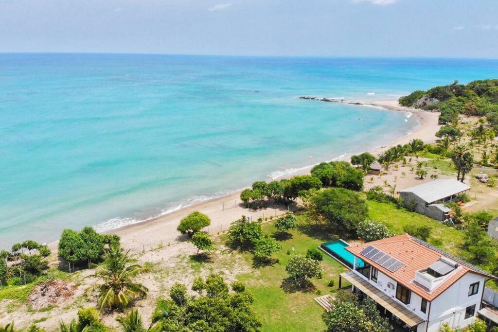 an aerial view of a house next to a beach at Nilaveli Bay Villa by Ceylon Spaces in Nilaveli