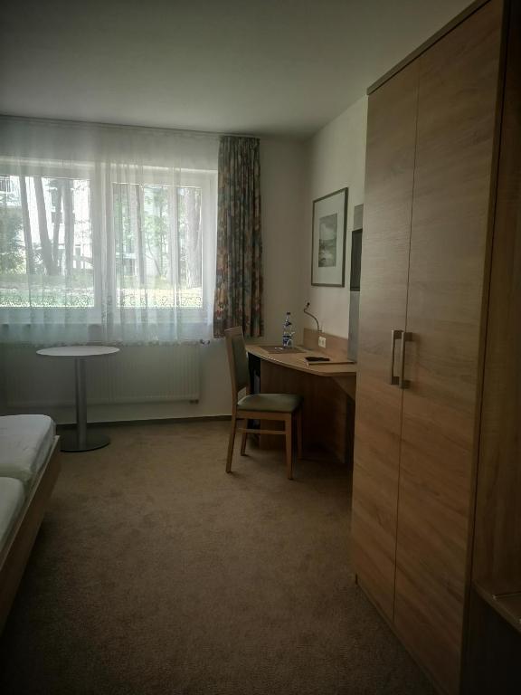 Postel nebo postele na pokoji v ubytování Hotel Garni Meeresblick