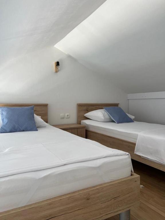 Postel nebo postele na pokoji v ubytování Apartman I & R