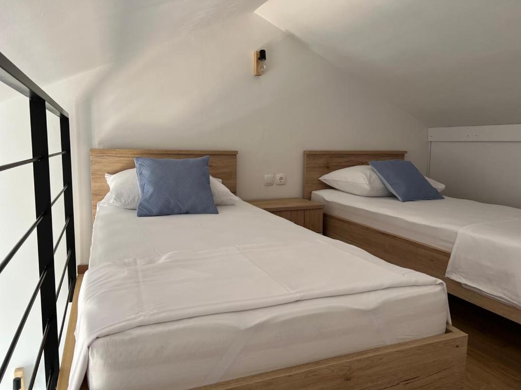 Postel nebo postele na pokoji v ubytování Apartman I & R