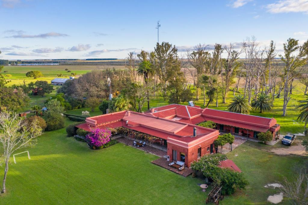 an overhead view of a home with a red roof at Estancia La violeta in Chajarí