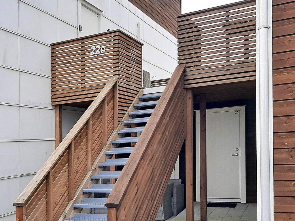 a wooden staircase leading up to a building at 4 person holiday home in FARSUND-By Traum in Farsund