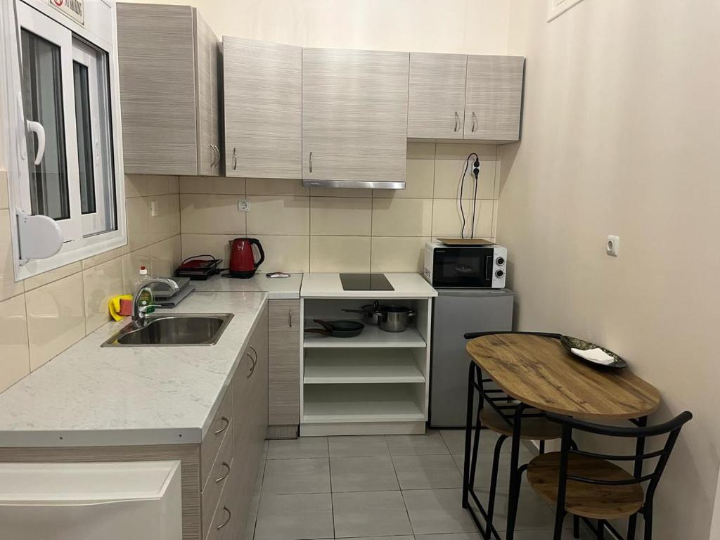Kuchyň nebo kuchyňský kout v ubytování Golden Fleece Apartment VIPGreece