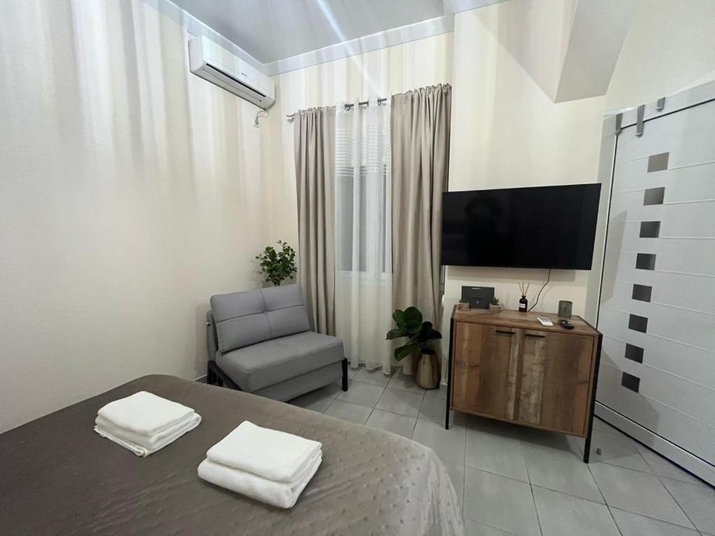 TV a/nebo společenská místnost v ubytování Golden Fleece Apartment VIPGreece