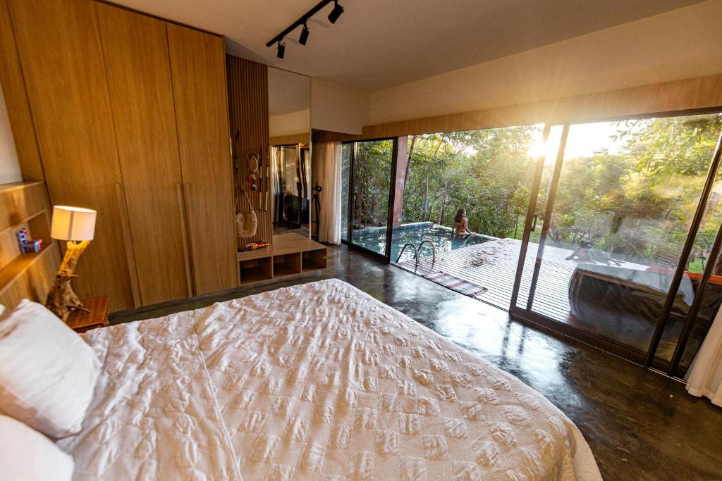 Postel nebo postele na pokoji v ubytování Quinta dos Goyazes Eco Boutique pra curtir a dois em Pirenópolis