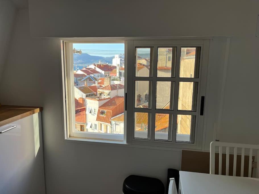 a window in a room with a view of a city at Magnifico Piso Nuevo con Vistas in Vigo