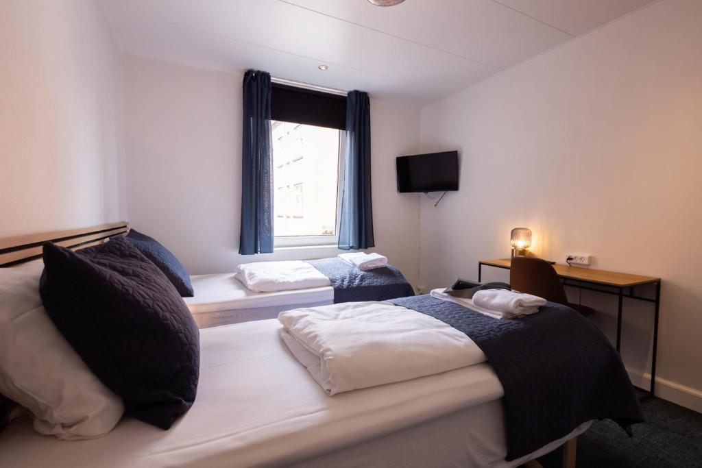 Una cama o camas en una habitación de Milling Hotel Mini 19