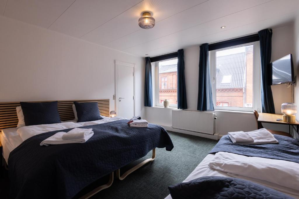 Una cama o camas en una habitación de Milling Hotel Mini 19