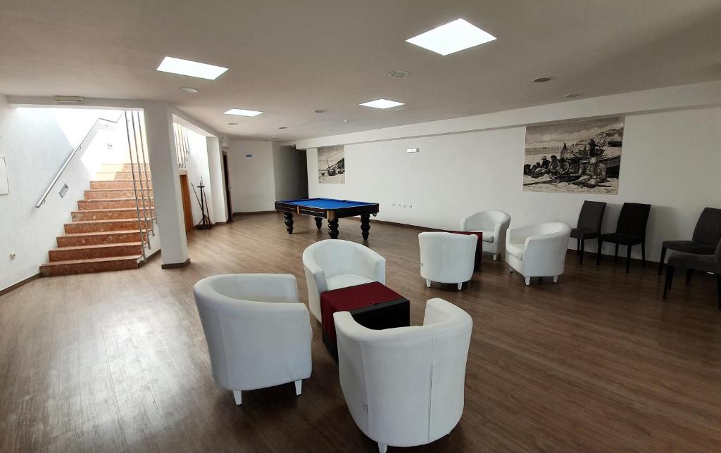 Uma área de estar em Miramar Hotel Spa & Apartments