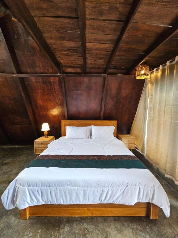 Postel nebo postele na pokoji v ubytování UmaUthu Bali