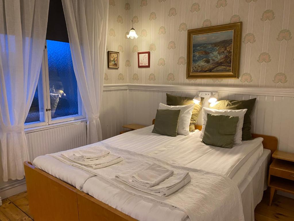 Postel nebo postele na pokoji v ubytování Borgs Villahotell och B&B