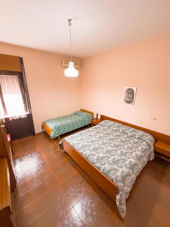 Postel nebo postele na pokoji v ubytování HOTEL 1+1 di C.Costabile & f.lli