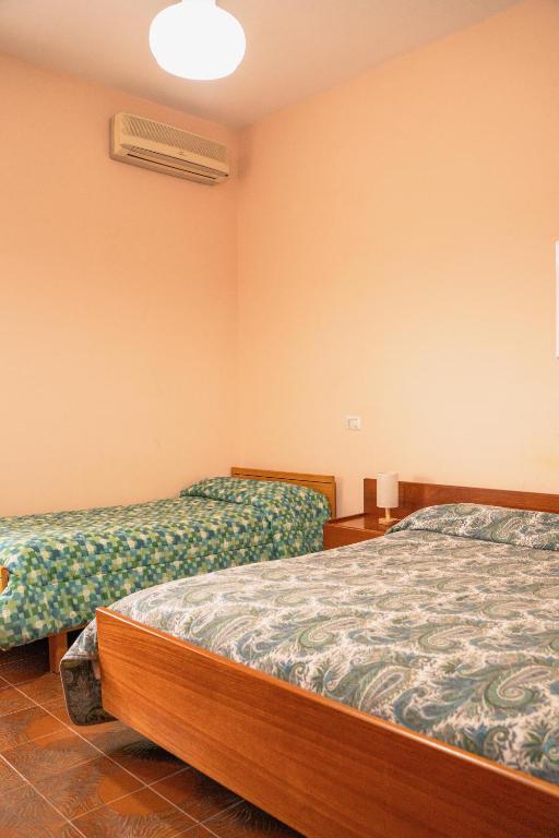 Postel nebo postele na pokoji v ubytování HOTEL 1+1 di C.Costabile & f.lli