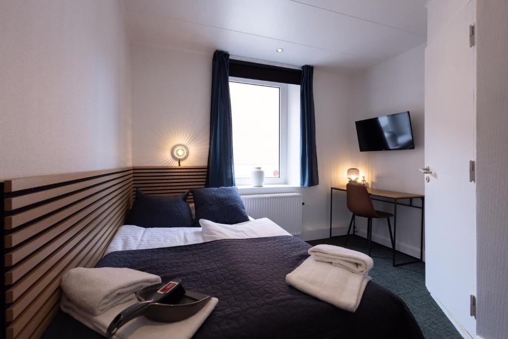 Una cama o camas en una habitación de Milling Hotel Mini 19