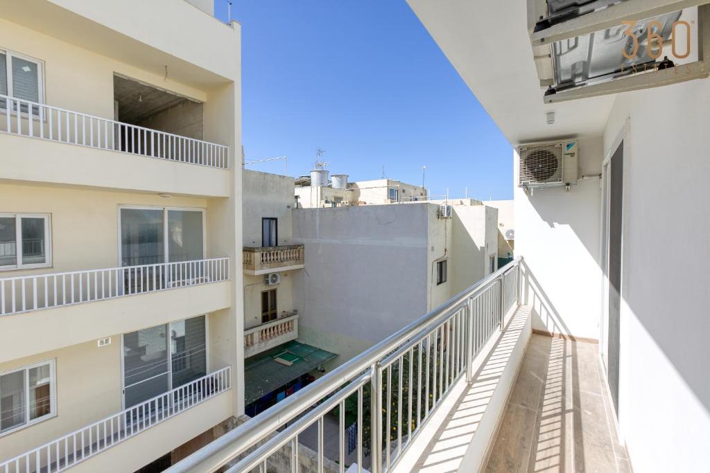 a view from the balcony of a apartment building at Bright &amp; cosy 3BR home with private balcony &amp; WIFI by 360 Estates in Dingli