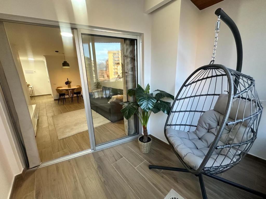a hanging chair in a room with a living room at VILLA MOLEIRO RAMBLA in Santa Cruz de Tenerife