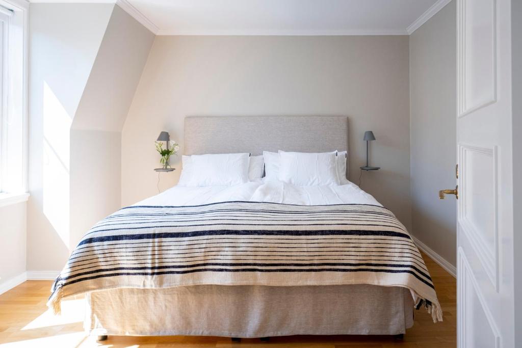 Postel nebo postele na pokoji v ubytování Blå Huset