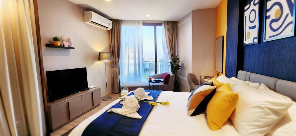 Ένα ή περισσότερα κρεβάτια σε δωμάτιο στο Edge Central Pattaya by Thida