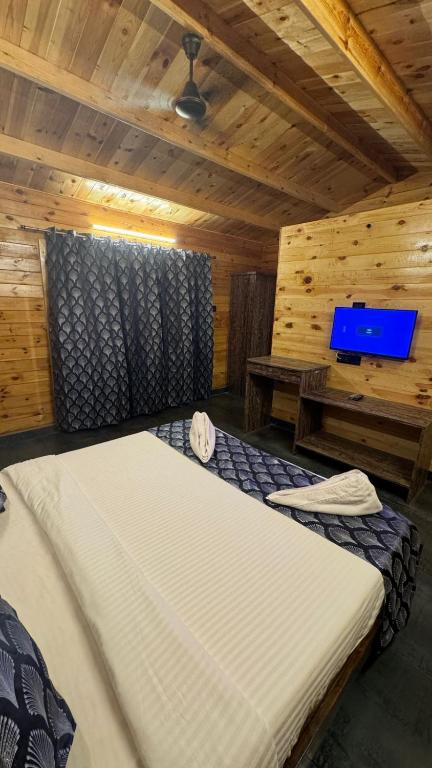 Postel nebo postele na pokoji v ubytování OZIBA BEACH RESORT