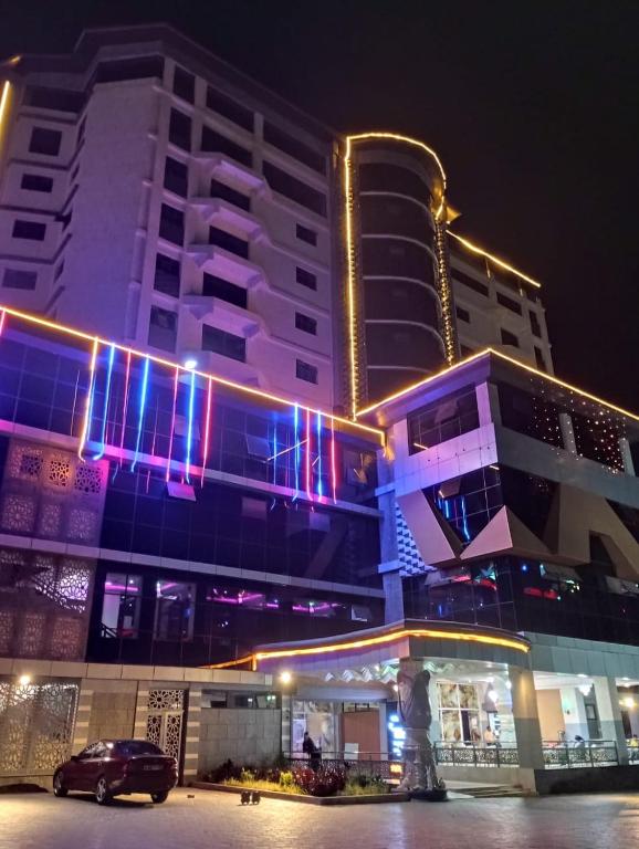 a large building with lights on it at night at THE MARK HOTEL in Nairobi