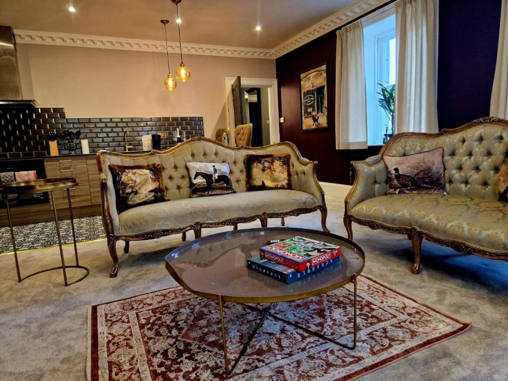 a living room with two couches and a coffee table at Hamilton-The Alexander suite luxury holiday Let's in Scorton