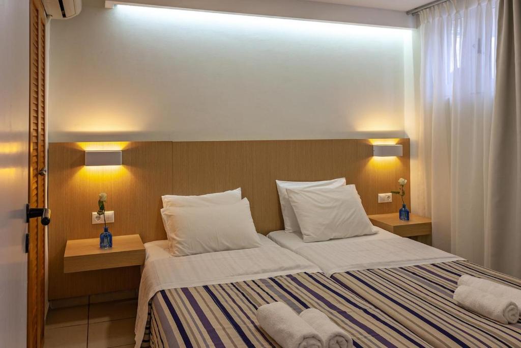 Postel nebo postele na pokoji v ubytování Oliv Apartments