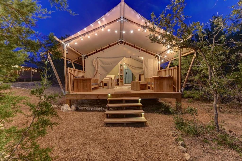 a large tent with a staircase in front of it at Tent#5-Camping Tent on a Winery in Texas Hill Country in Johnson City