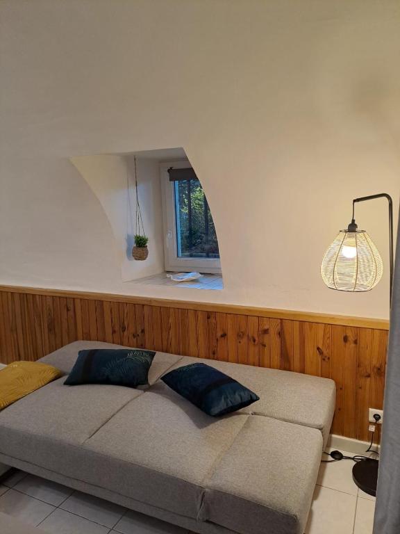 Postel nebo postele na pokoji v ubytování Gîte 2 "Le Tilia " aux magnolias 3 étoiles