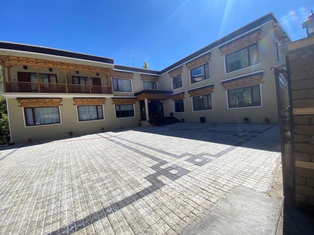 an empty parking lot in front of a building at Casa Galwan in Leh
