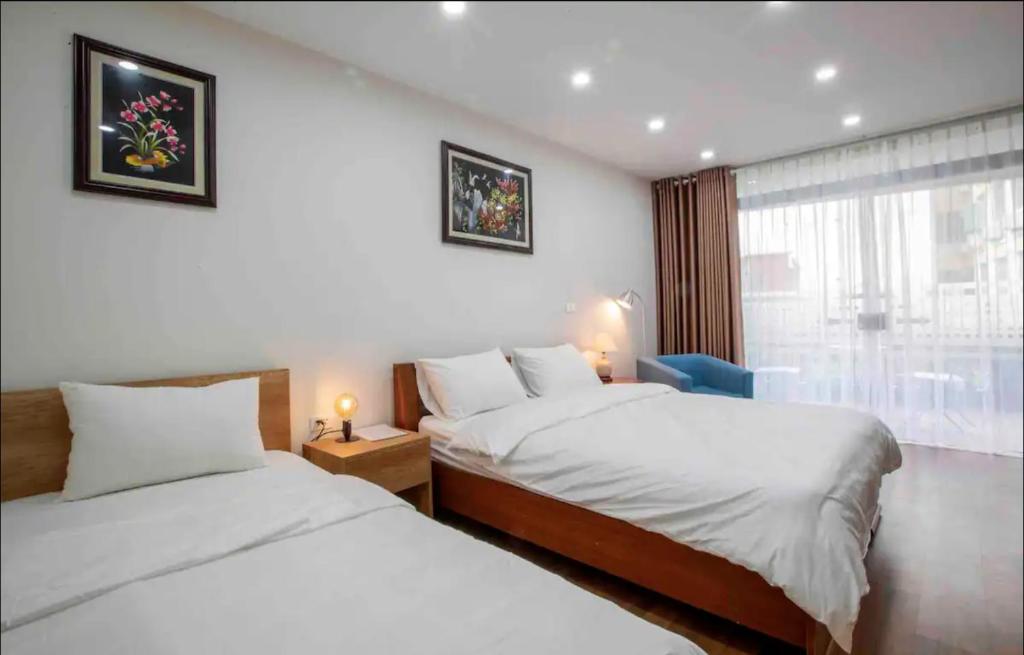 Postel nebo postele na pokoji v ubytování Picturesque Hanoi Homestay