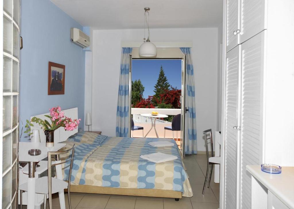 Postel nebo postele na pokoji v ubytování Oliv Apartments
