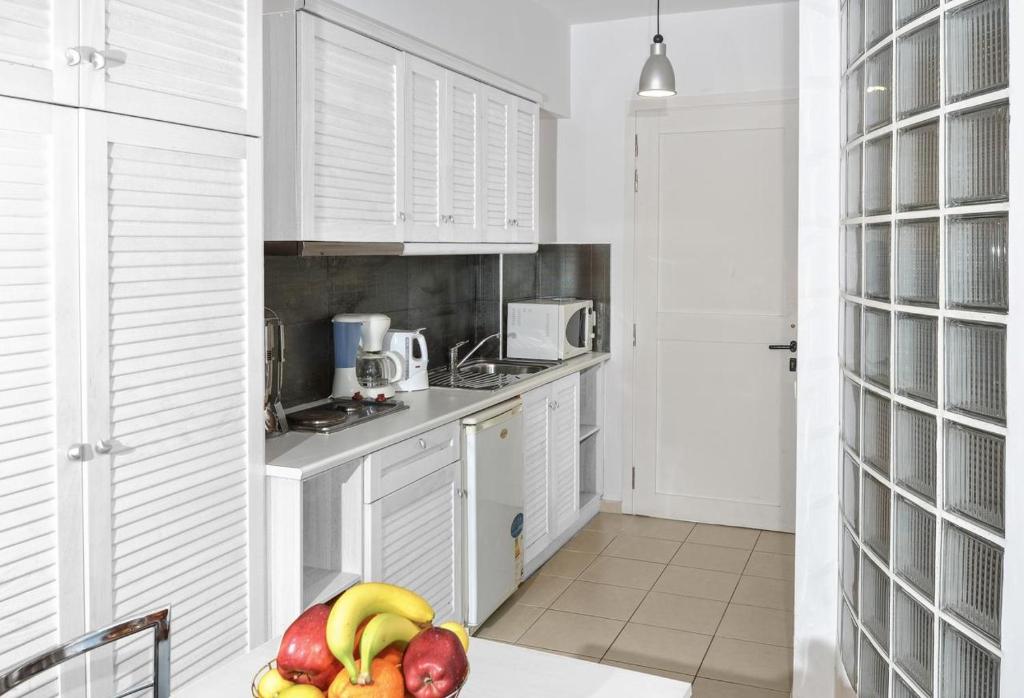 Kuchyň nebo kuchyňský kout v ubytování Oliv Apartments