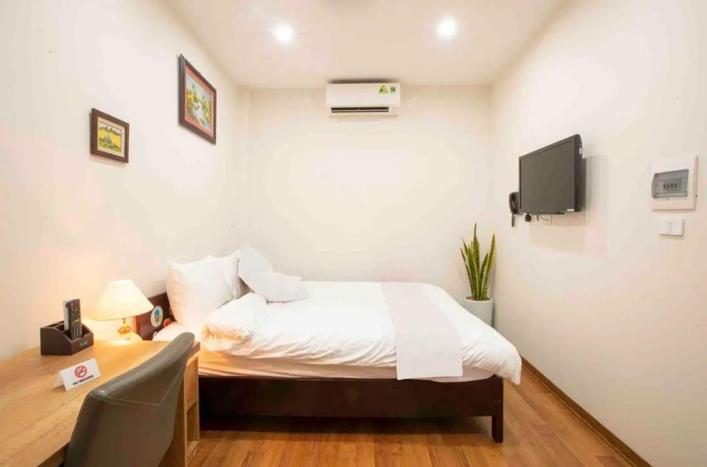 Postel nebo postele na pokoji v ubytování Picturesque Hanoi Homestay