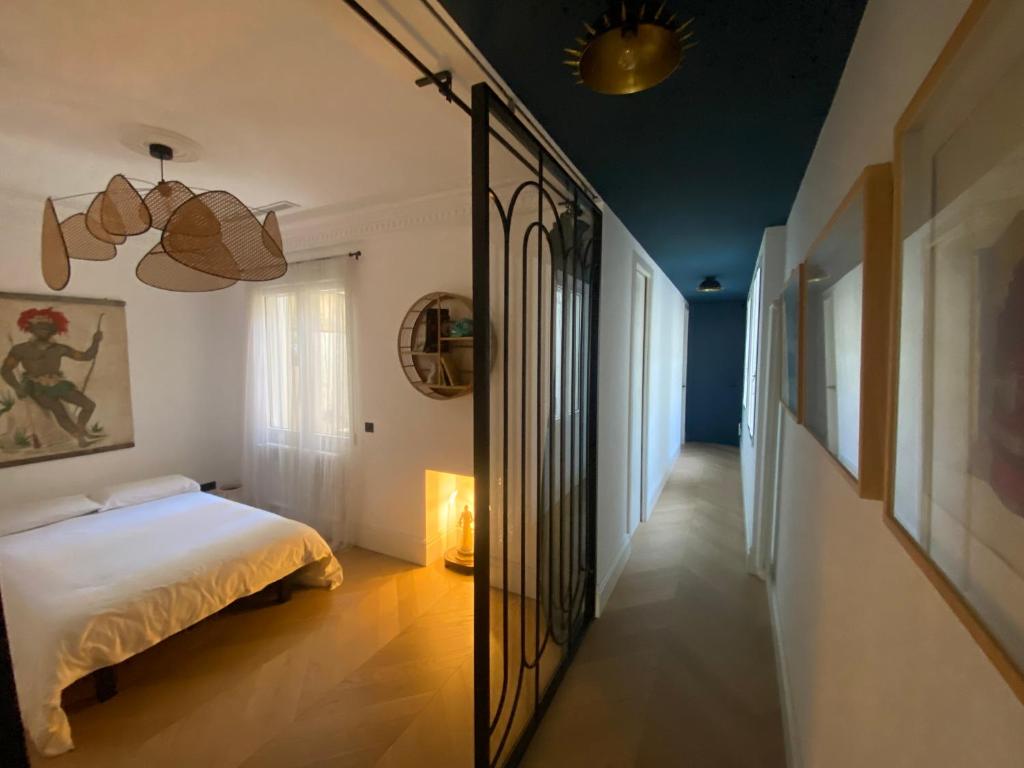 a bedroom with a bed and a hallway at Luxury apartment in Gran Vía in Madrid