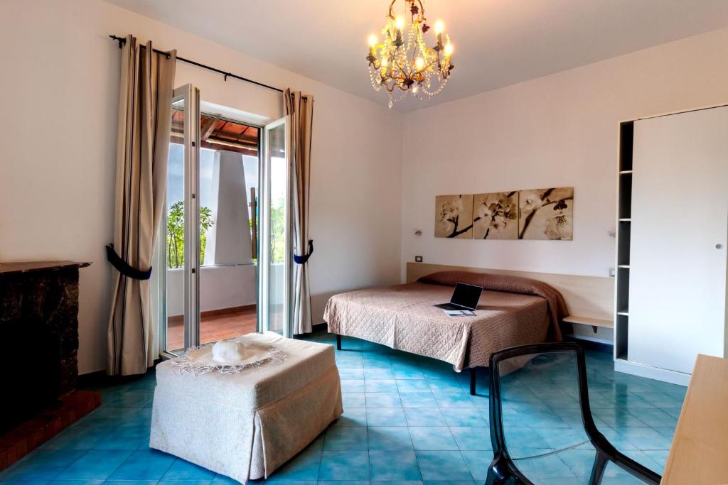 Postel nebo postele na pokoji v ubytování Don Giorgio Rooms & Apartments