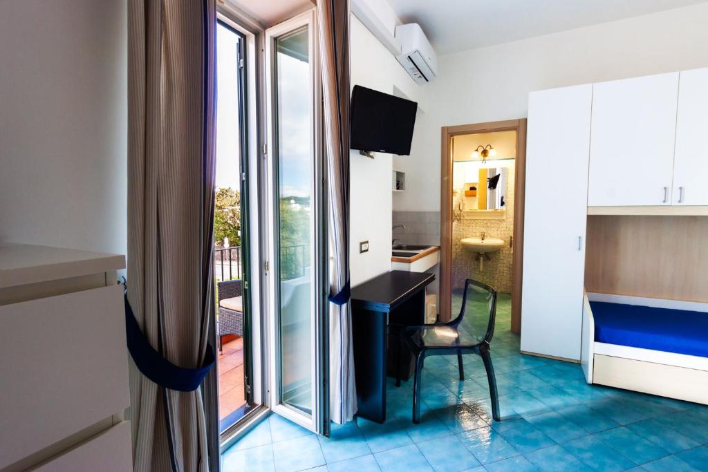 TV a/nebo společenská místnost v ubytování Don Giorgio Rooms & Apartments