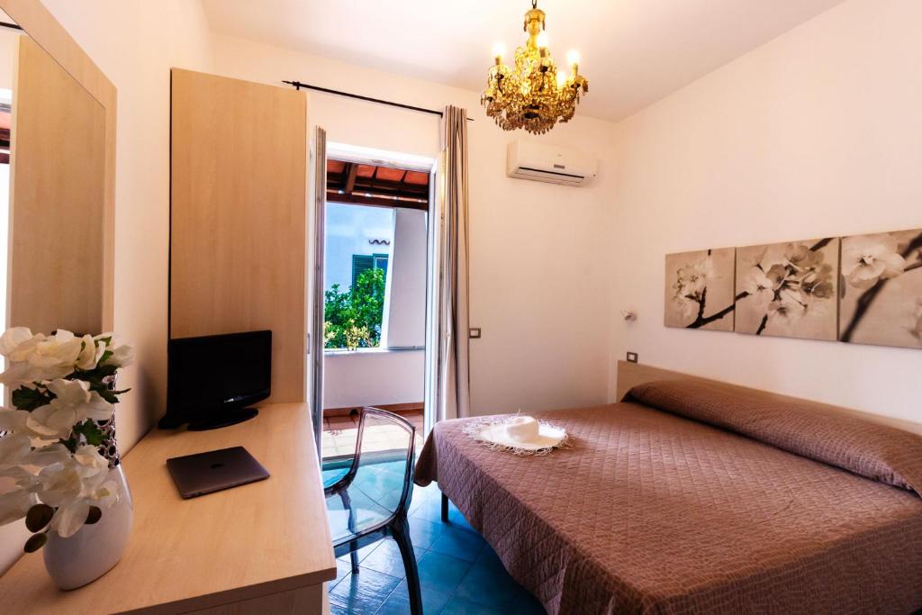 TV a/nebo společenská místnost v ubytování Don Giorgio Rooms & Apartments