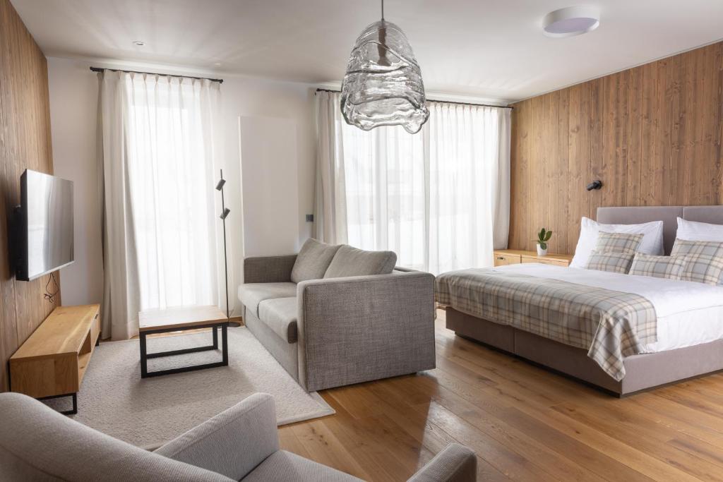 Postel nebo postele na pokoji v ubytování Aldrov Resort